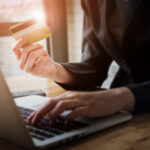 Online payment,Woman's hands holding smartphone and using credit card for online shopping.
