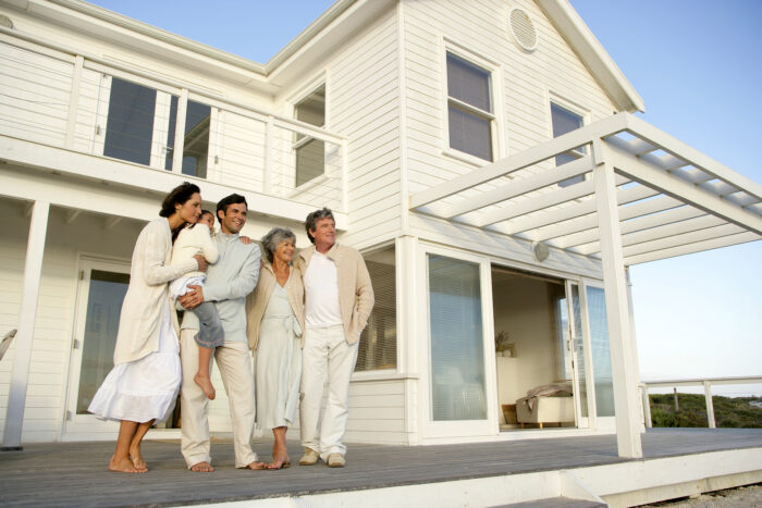 family standing in front of vacation home